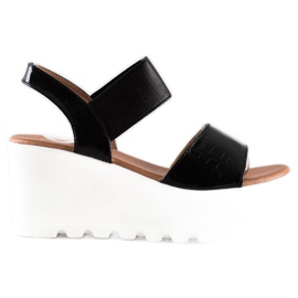 Weide Lette sandaler på en hvid kile sort