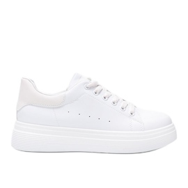 Hvide sneakers på en fyldig Justar sål beige