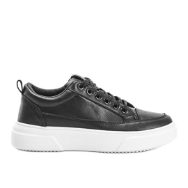 Sorte sneakers på en fyldig Aruba sål