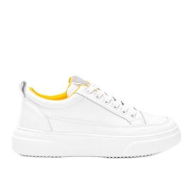 Hvide sneakers på en fyldig Aruba sål