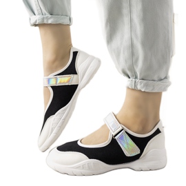 Sort / hvide sneakers med et holografisk Melania -indlæg