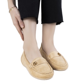 Beige mokasiner på en skjult Linette -kile