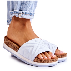 PG1 Dame suede hjemmesko på en massiv blå Heritta platform