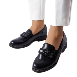 Sorte loafers dekoreret med en bue og rhinestones