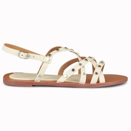 Beige damesandaler med metaldekorationer