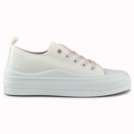 Kvinders hvide sneakers på platformen