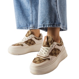 Inna Beige sneakers dekoreret med Conte-monogrammet