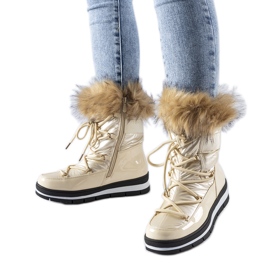 Beige patent snestøvler med sløjfepels