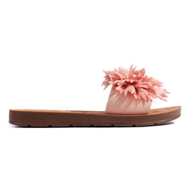 Pink dameflip-flops med en blomst lyserød