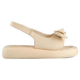 Beige damesandaler med bamsesløjfe på platformen