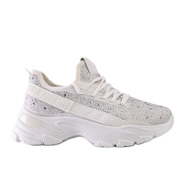 Hvide skinnende sneakers med en massiv Senai-sål