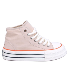 Damesneakers på den beige platform