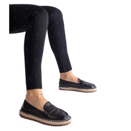 Sort glidende espadriller på platformen
