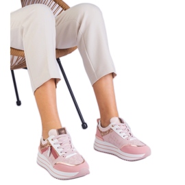 Lyserøde sports -sneakers på platformen dekoreret med glitter