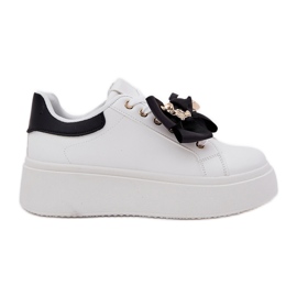 Kvinders sneakers med en bue og en broche med en hvid og hvid bamse