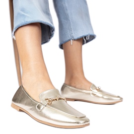 Golden elegante loafers med en gylden dekoration og zirkoner
