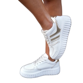 Kvinders sneakers på guldplatformen gylden