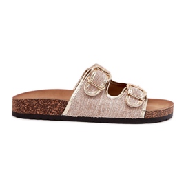 Kvinders materiale flip flops på en korkplatform med gyldne spænder gylden