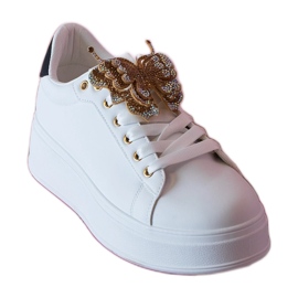 Sort og hvide sneakers dekoreret med en sommerfugl med zirkoner