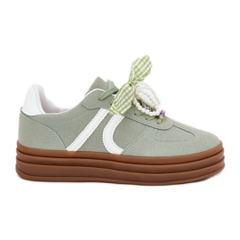 Kvinders sneakers på platformen med grønne ornamenter