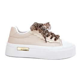 Kvinders sneakers på en massiv platform med dekorativ snøring beige