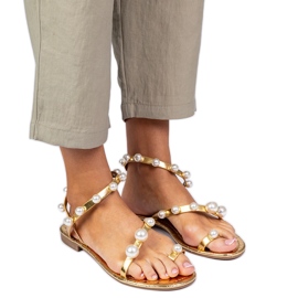 Golden kvinders sandaler dekoreret med perler gylden