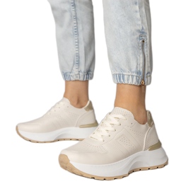 Beige sports sneakers med en gylden indsættelse