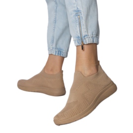 Beige sports -sneakers med en soking øvre