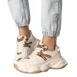 Beige sneakers kvindes sport med en leopardindsats