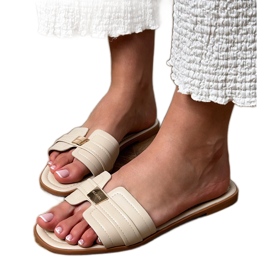 Beige kvinders flip flops med et ornament på bæltet
