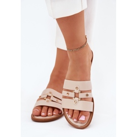 Flad kvinders flip flops med gylden detalje beige