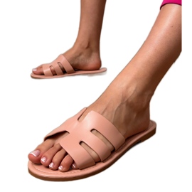 Pink flip -flops dekoreret med udskæringer lyserød