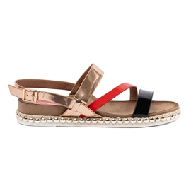 Kvinders sandaler med en dekoreret sål gylden
