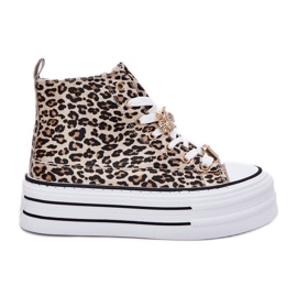 Kvinders høje sneakers på en massiv platform med pins leopard leopard gylden
