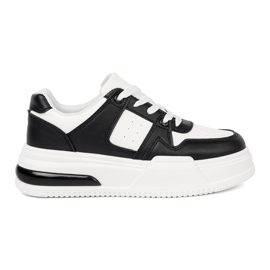 Shelvt Stilfuld sort og hvide sneakers med en tyk sål