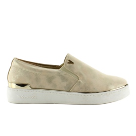 Slip-on med en metallisk trim 786 Gold gylden