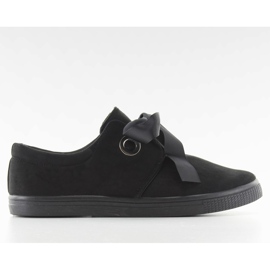 Sneakers bundet med et JX49 sort bånd