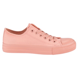 Lyserøde sneakers på bindingen