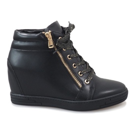 Sorte sneakers med en guld TL-22 lynlås