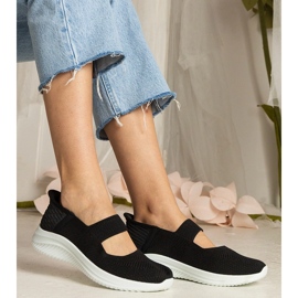 Sorte kvinders sneakers på en presset sål 1