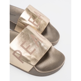 Shelvt Golden Flat flip flops med en inskription gylden 1